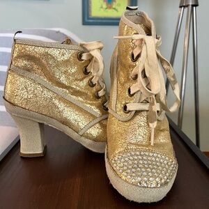 Rebels distressed metallic gold, rhinestones, high top heeled tennis shoe boots.